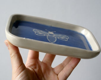 Honey bee motif ceramic pottery trinket tray in dark blue