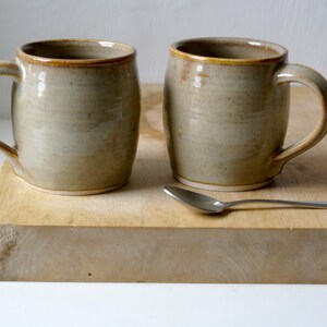 Set of two cozy stoneware pottery tea mugs glazed in glossy grey image 2