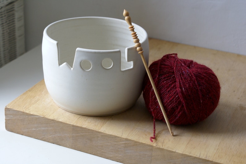 The front of a wool yarn bowl glazed in vanilla cream