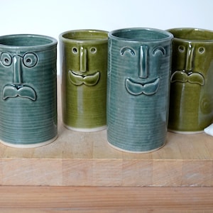 Handcrafted stoneware vase with moustache face versatile desk caddy and utensil holder