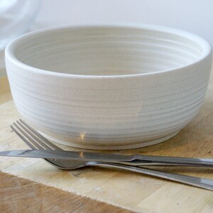 A large salad bowl glazed in vanilla cream