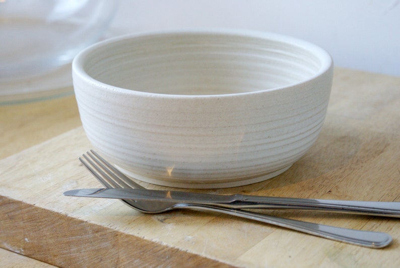 A large salad bowl glazed in vanilla cream