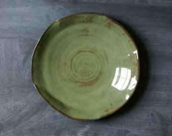 Unique ripple edge hand thrown ceramic plate in mossy green