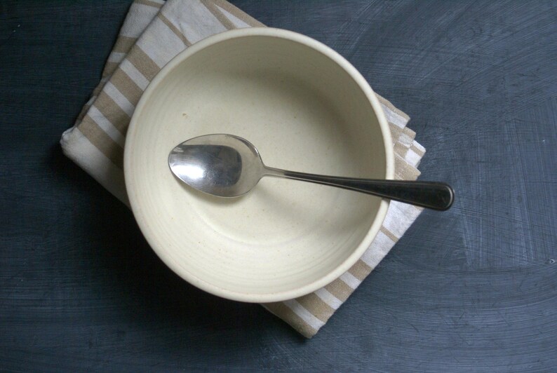 A flat lay view of a large salad bowl hand thrown stoneware pottery