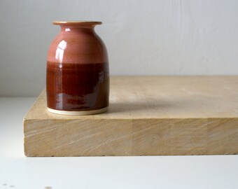 Handmade stoneware bottle vase with glossy red and pink glaze accents