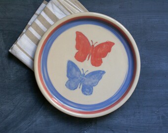 Hand thrown butterfly motif plate in blue and pink