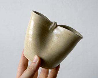 Hand thrown stoneware milk jug glazed in matte sandy beige