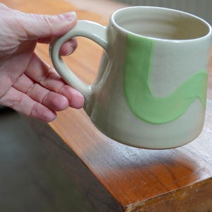 SALE - Hand thrown pottery mug with pale green doodle design