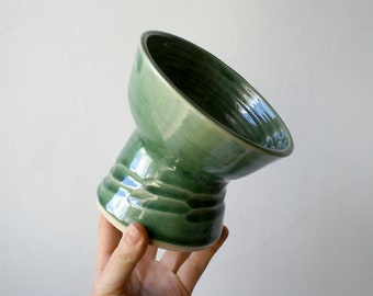 Elevated pedestal cat feeding bowl glazed in forest green with textural etching detail