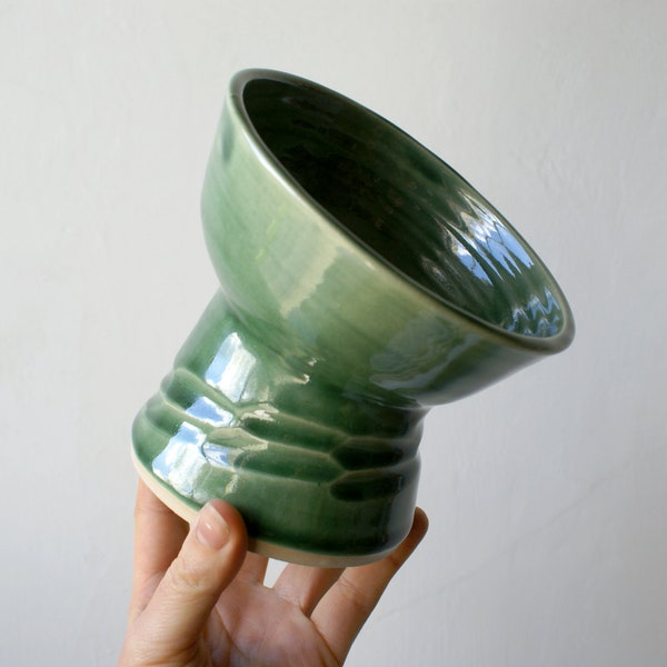 Elevated pedestal cat feeding bowl glazed in forest green with textural etching detail