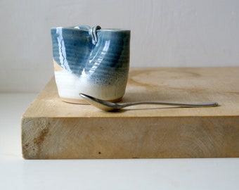 Petite folded hand thrown stoneware milk jug glazed in ice blue and vanilla cream