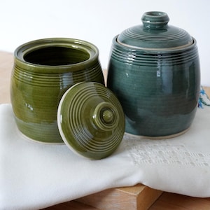Hand thrown stoneware jar with etched line detail in blue or green glossy glaze