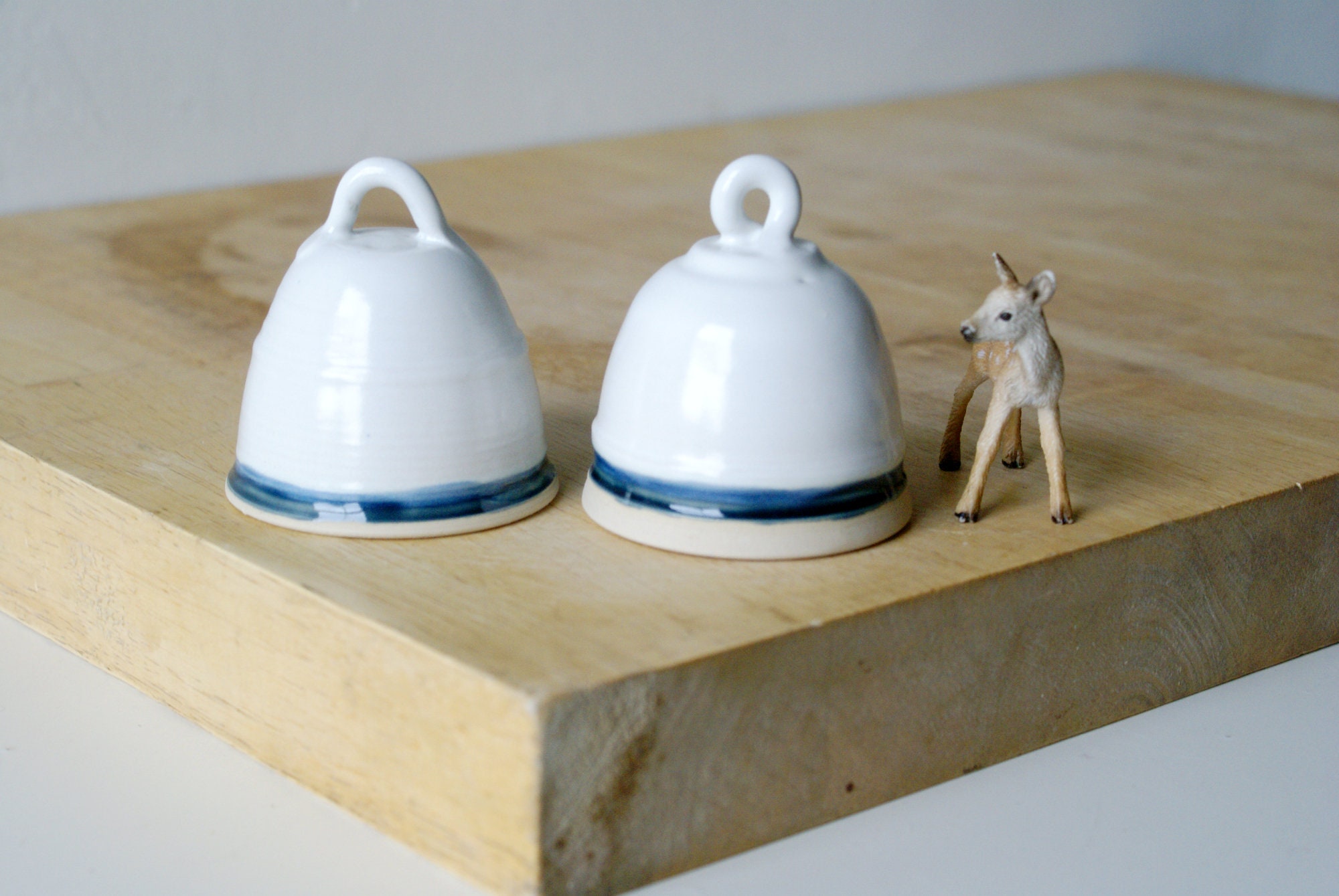 Two ceramic bell decorations glazed in white and blue Etsy