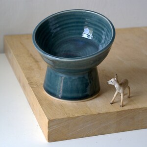 Elevated pedestal cat feeding bowl glazed in glossy ice blue