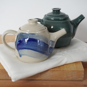 Handmade stoneware teapots glazed in green, blue and transparent