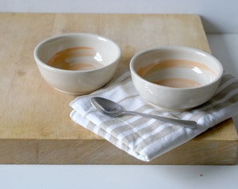 Set of two snack bowls in simply clay with orange brushstroke decoration