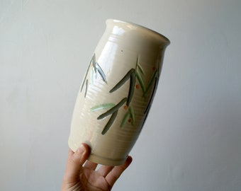 Hand thrown pottery vase with elegant hand painted leaves and berries pattern