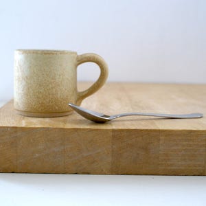 Hand thrown espresso stoneware cups glazed in matt sandy brown