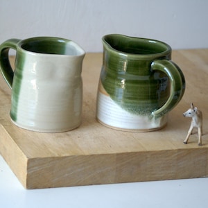 Hand thrown pottery jug glazed in shades of green with 400 ml capacity