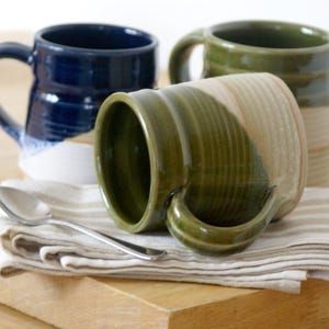 One large pottery tea mug in two tone colours, either green or blue finish