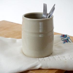 Hand thrown stoneware pottery utensil holder in glossy simply clay