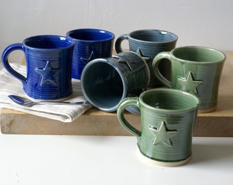 Set of two hand thrown pottery mugs with pointed star motif