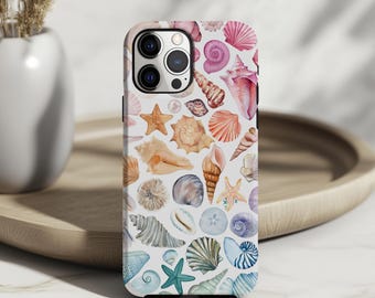 May include: A white iPhone case with a colorful watercolor pattern of seashells and starfish. The case has a camera cutout and a black border.