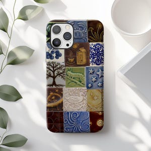 May include: A phone case with a colorful patchwork design featuring various images, including a tree, a caterpillar, a duck, a crab, and a milk carton. The case is made of a hard plastic material and has a cutout for the phone's camera.