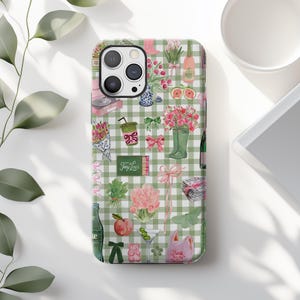 May include: A smartphone case featuring a light green and white gingham pattern decorated with various watercolor illustrations including pink flowers, green boots, a martini glass, a peach, a pink bow, and a matchbox labeled Tiny Lou's.