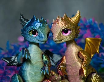 Articulated 3D Printed Dragon with Glass Eyes.  Flexible dragon