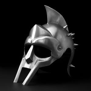May include: A silver-colored gladiator helmet with a prominent crest and spiked details. The helmet features a face guard and eye openings, set against a black background. The metallic surface reflects light, highlighting its intricate design.