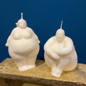 Sitting and standing two fat ladies chubby woman body torso candles abstract fragranced