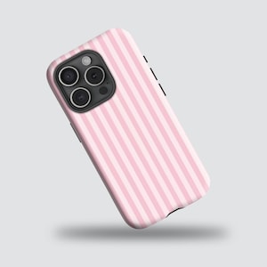 May include: A pink and white striped phone case. The case has a glossy finish and a camera cutout with three lenses. The design features vertical stripes in alternating shades of pink and white.