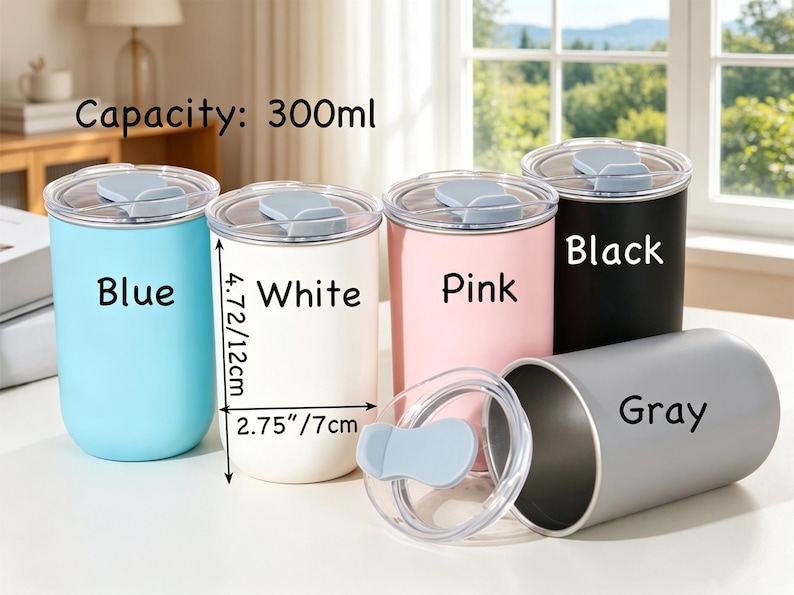 May include: Five cylindrical tumblers with 300ml capacity, each featuring a clear lid with a light blue tab. Colors include blue, white, pink, black, and gray. The white tumbler measures 4.72 inches in height and 2.75 inches in diameter.