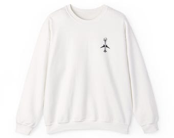 May include: White crewneck sweatshirt with a small graphic of a wrench and airplane. The graphic is centered on the chest. The sweatshirt has long sleeves and a ribbed neckline, cuffs, and hem. The fabric appears to be a soft, medium-weight material.