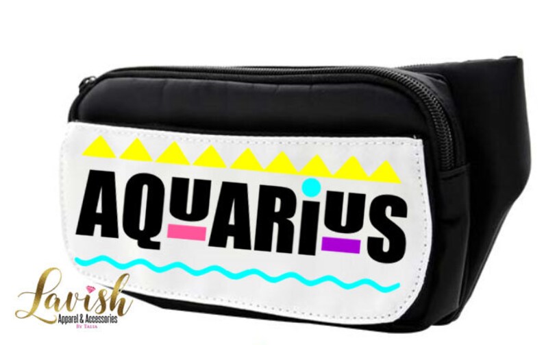May include: Black fanny pack with a white patch that says "AQUARIUS" in black letters with pink, purple, and blue accents. The patch has a yellow and white geometric design.