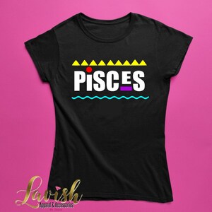 May include: Black t-shirt with a white "PISCES" graphic in a retro 90s style. The graphic features yellow triangles, a red dot, and a blue wavy line.