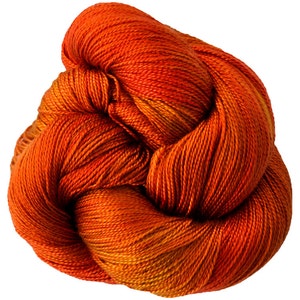 May include: A skein of orange and yellow yarn, with a gradient of colour from dark orange to light yellow.