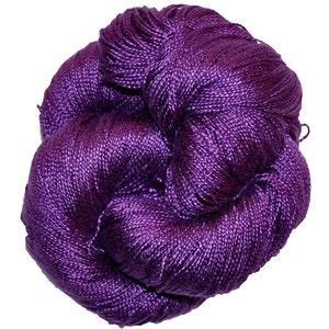 May include: A skein of deep purple silk yarn, ideal for knitting or crocheting.