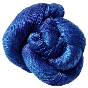 May include: A skein of blue yarn with a gradient of colour from dark blue to light blue.