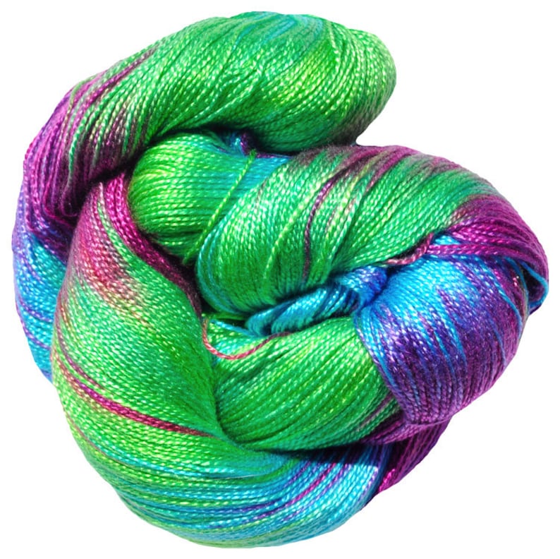 May include: A skein of yarn in shades of green, blue, and purple. The yarn is twisted and knotted, creating a colorful and textured effect.