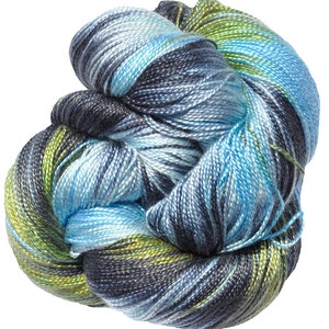 May include: A skein of yarn in a blue, green and black colourway. The yarn is twisted and knotted, showing the different colours.