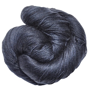 May include: A skein of dark blue yarn with a subtle sheen.
