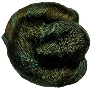 May include: A skein of dark green and teal yarn with a subtle shimmer.