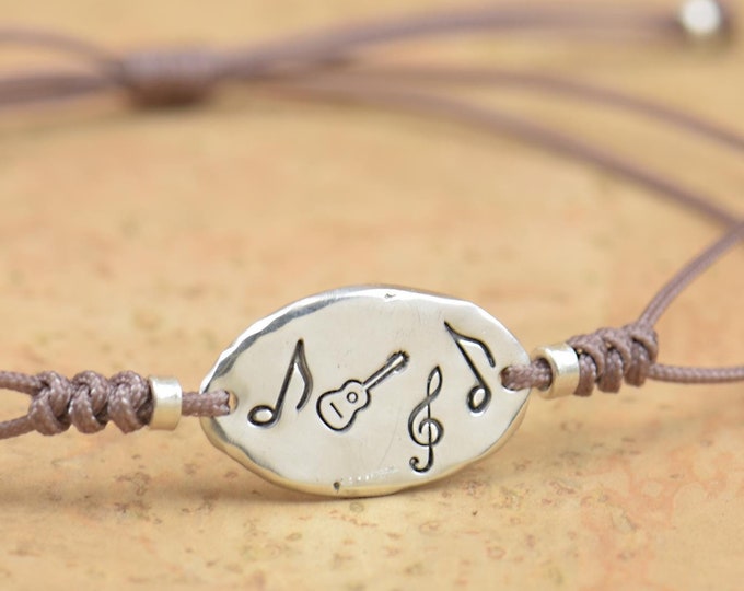 Sterling silver tiny guitar music note charm bracelet.Spanish guitar bracelet