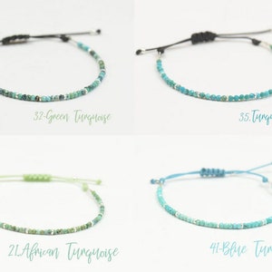 May include: Four adjustable bracelets featuring turquoise beads and silver details. The bracelets are labelled: "32-Green Turquoise", "35. Turquoise", "21. African Turquoise", and "41-Blue Turquoise". Each bracelet has a black or light-coloured cord.