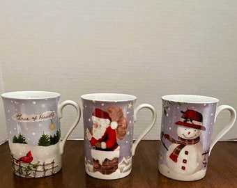 3-Lenox Mugs Christmas Collage A Discontinued Pattern Excellent Condition Holds 16 Ounces of Liquid.