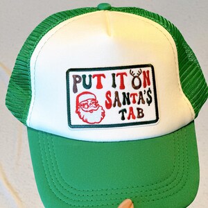 Put it On Santa's Tab Patch Trucker Hat