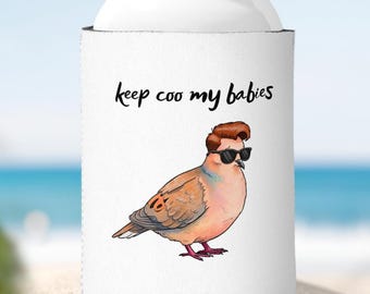 May include: White can cooler featuring a cartoon bird with sunglasses and a stylish hairstyle. The bird is light brown with red feet. The text "keep coo my babies" is written in black script.