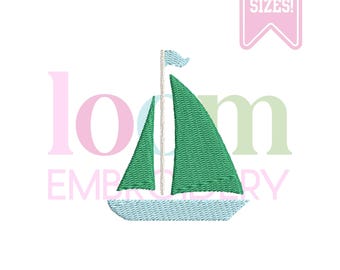 May include: A green sailboat embroidery design with a light blue hull and sails. The mast has a small light blue flag. The image includes the text "5 SIZES!" in a pink banner. The word "loom" and "embroidery" are also in the image.